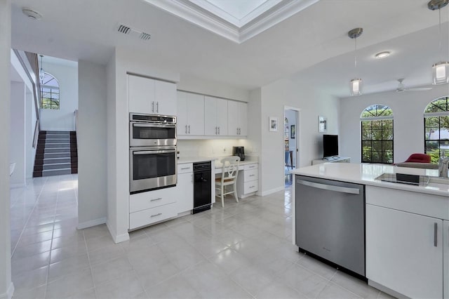 kitchen featuring pendant lighting, white cabinets, ceiling fan, appliances with stainless steel finishes, and light tile patterned flooring