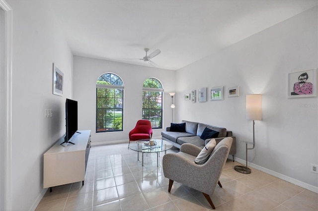 tiled living room with ceiling fan