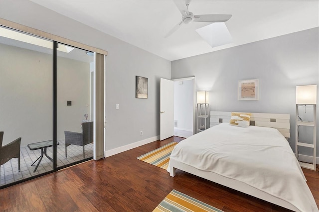 bedroom featuring dark hardwood / wood-style flooring, access to outside, and ceiling fan