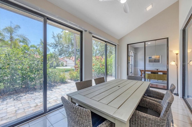 sunroom featuring ceiling fan and vaulted ceiling