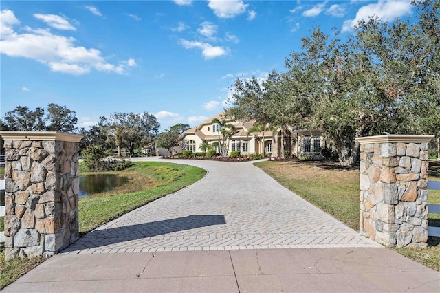 view of front of property with a water view