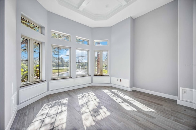 unfurnished sunroom with beamed ceiling and coffered ceiling