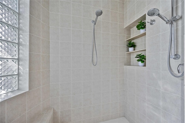 bathroom featuring a tile shower