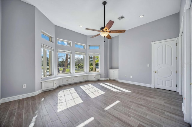 unfurnished bedroom featuring light hardwood / wood-style flooring and ceiling fan