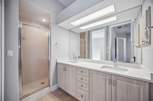 bathroom with vanity, tile patterned floors, and walk in shower