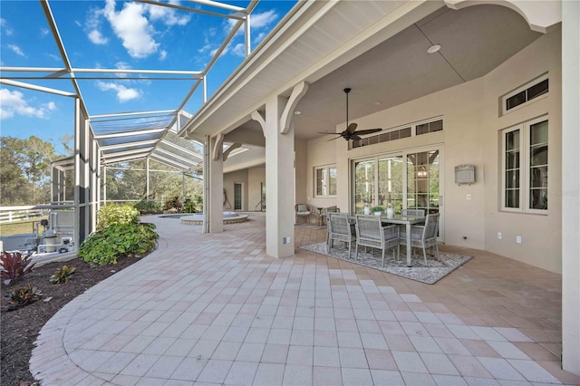 view of patio with a lanai and ceiling fan