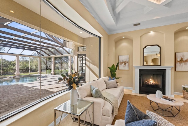 living room featuring coffered ceiling, beam ceiling, and a towering ceiling