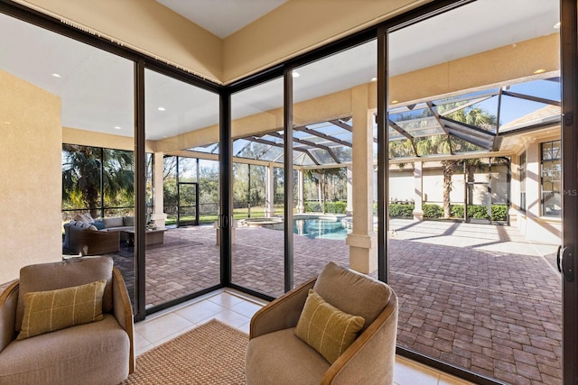 doorway to outside with light tile patterned flooring