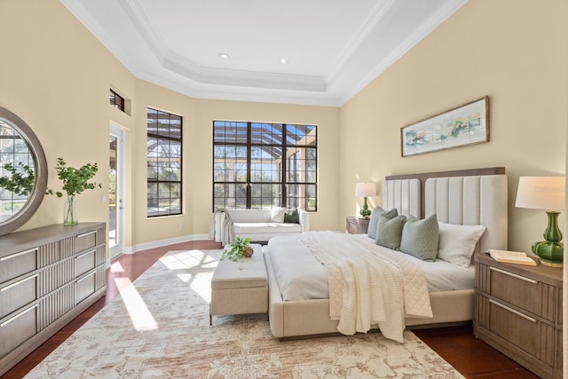 bedroom featuring access to outside, ornamental molding, a raised ceiling, and wood-type flooring