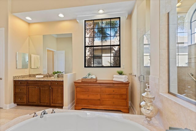 bathroom featuring an enclosed shower and vanity