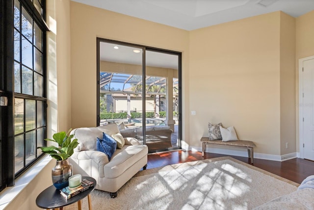 living area with hardwood / wood-style floors