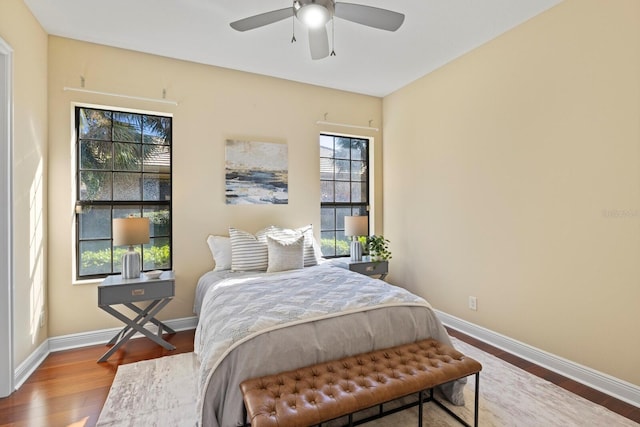 bedroom with wood-type flooring and ceiling fan