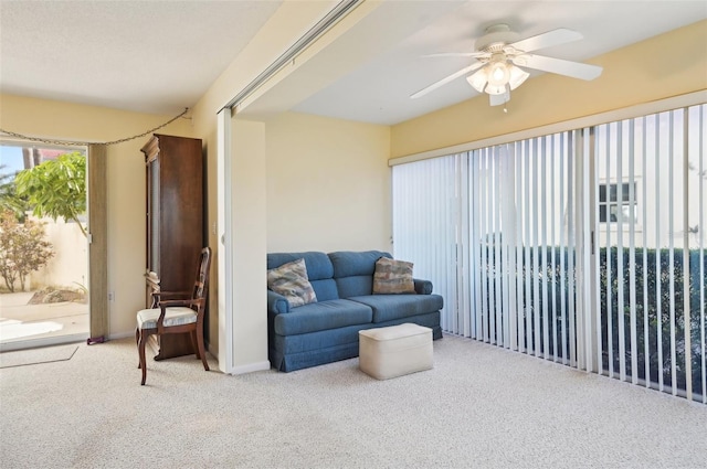 living room with carpet flooring and ceiling fan