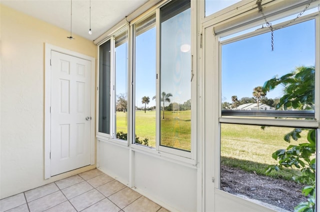 entryway featuring plenty of natural light and light tile patterned floors