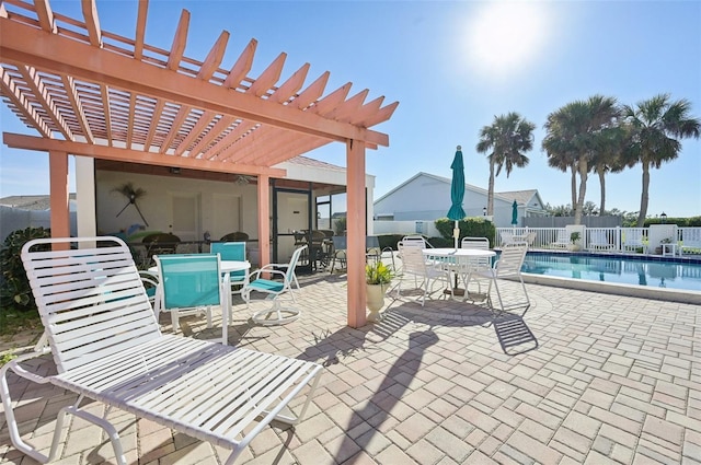 view of patio / terrace with a pergola and a community pool