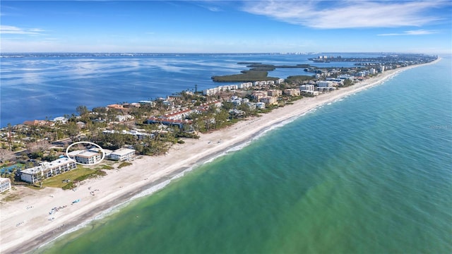 birds eye view of property featuring a water view and a view of the beach