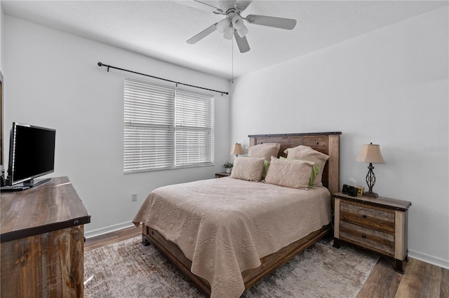 bedroom with wood-type flooring and ceiling fan