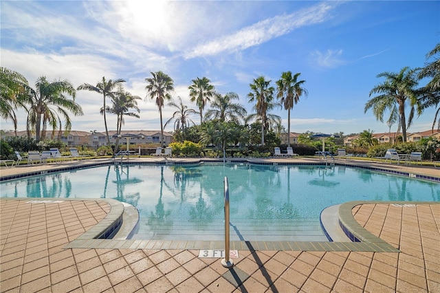 view of swimming pool with a patio