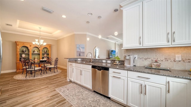 kitchen with white cabinetry, dishwasher, pendant lighting, and sink