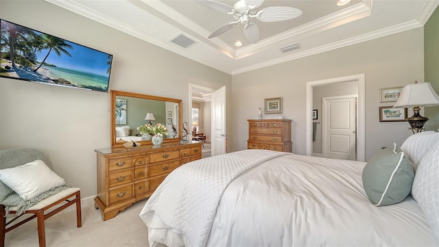 bedroom featuring a raised ceiling, ceiling fan, light carpet, and ornamental molding