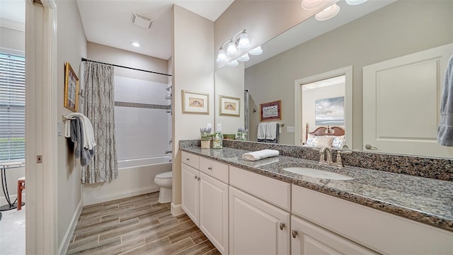 full bathroom with vanity, toilet, and shower / bath combo with shower curtain