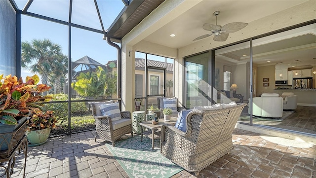 sunroom with ceiling fan