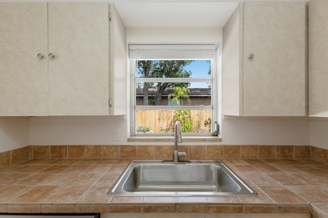 kitchen with a sink and white cabinets