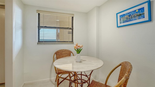 dining area featuring light tile patterned floors