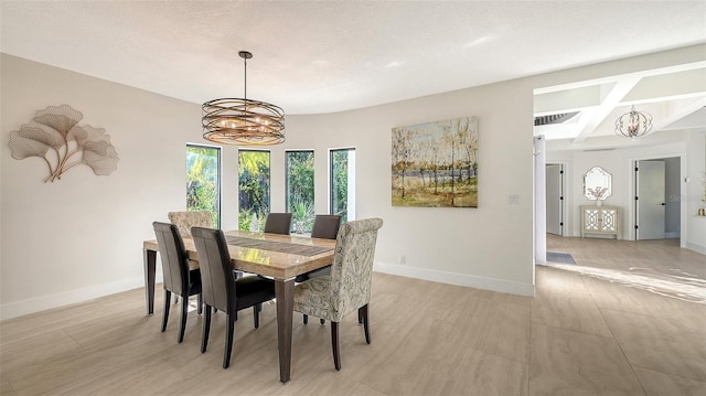 dining room featuring beamed ceiling, a chandelier, and a textured ceiling