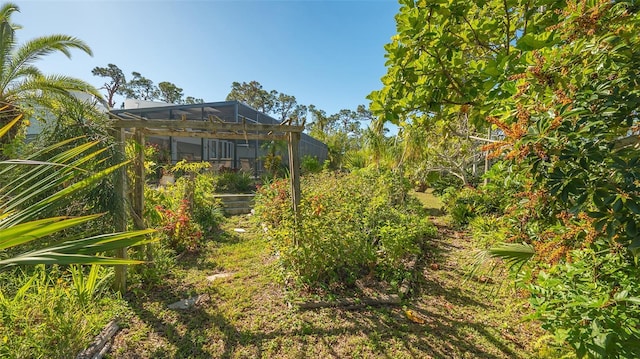 view of yard featuring a lanai