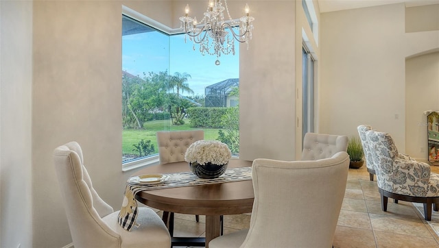 dining space featuring a chandelier and light tile patterned floors