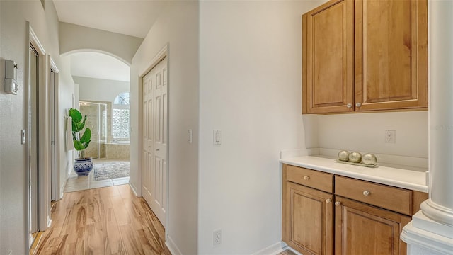 hallway with light wood-type flooring