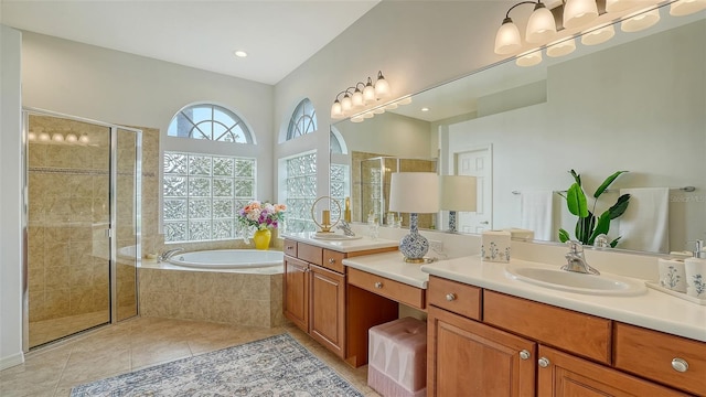 bathroom featuring vanity, tile patterned flooring, and plus walk in shower