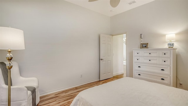 bedroom featuring ceiling fan, high vaulted ceiling, and light hardwood / wood-style flooring