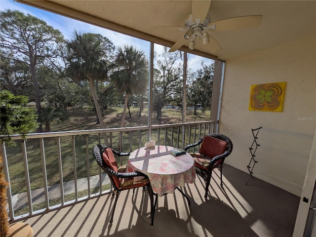 sunroom / solarium with ceiling fan