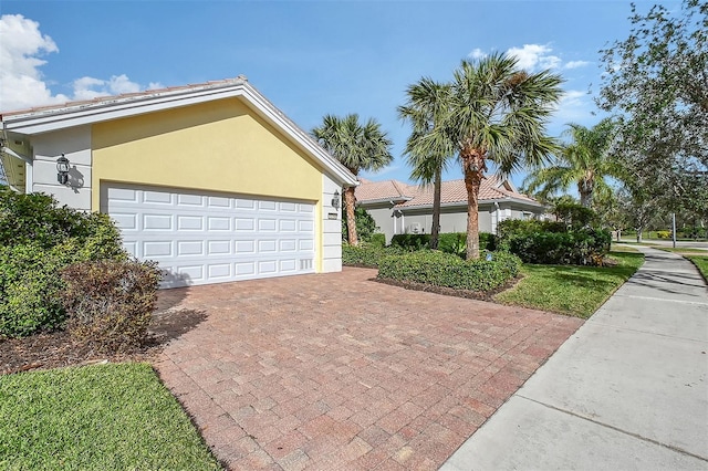 view of side of home with a garage