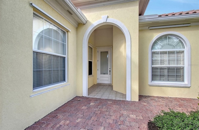 entrance to property featuring a patio area