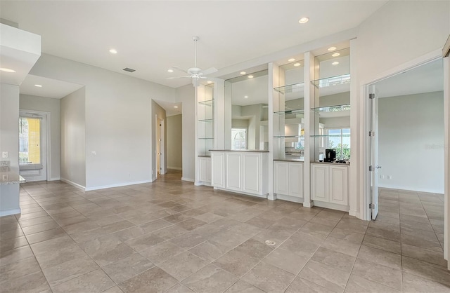 interior space with plenty of natural light and ceiling fan