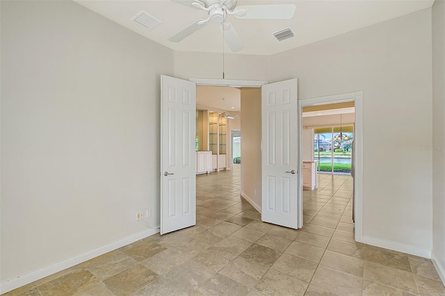 unfurnished room with ceiling fan