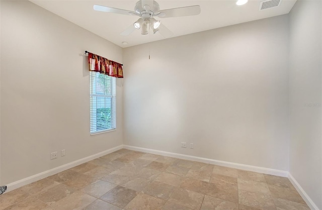 spare room with ceiling fan