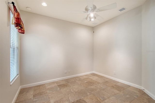 spare room with ceiling fan