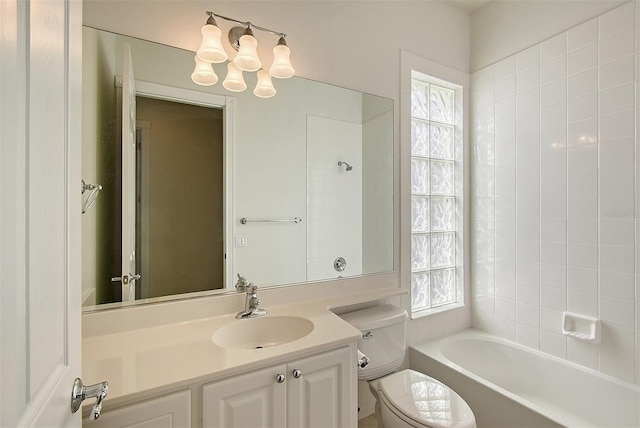 full bathroom featuring shower / bathing tub combination, vanity, and toilet