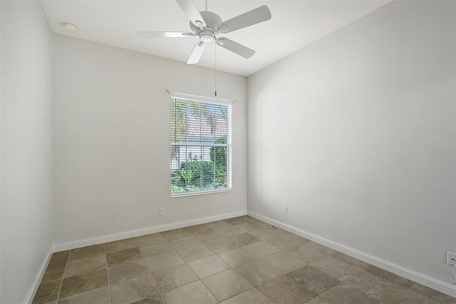 spare room with ceiling fan