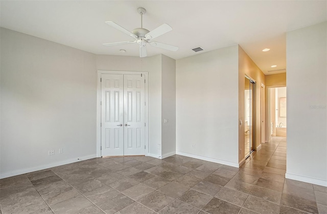 spare room with ceiling fan