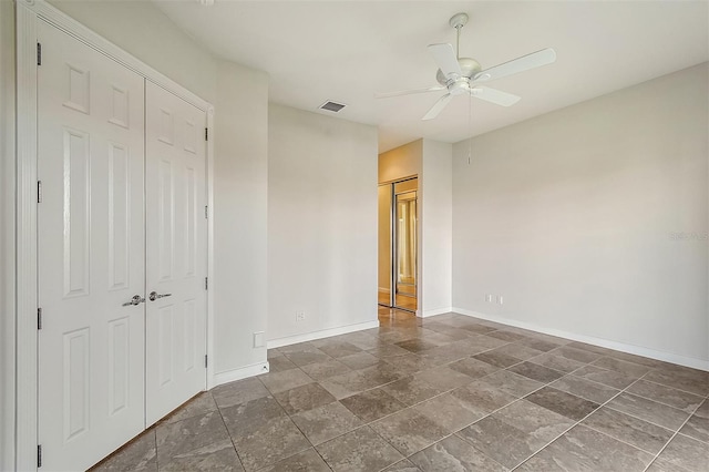 unfurnished bedroom featuring ceiling fan