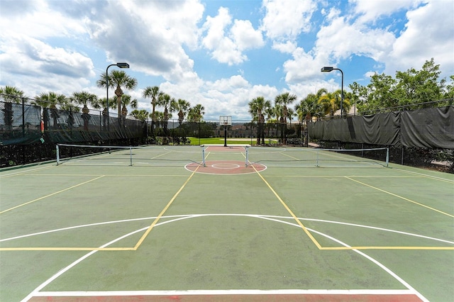 view of basketball court featuring tennis court