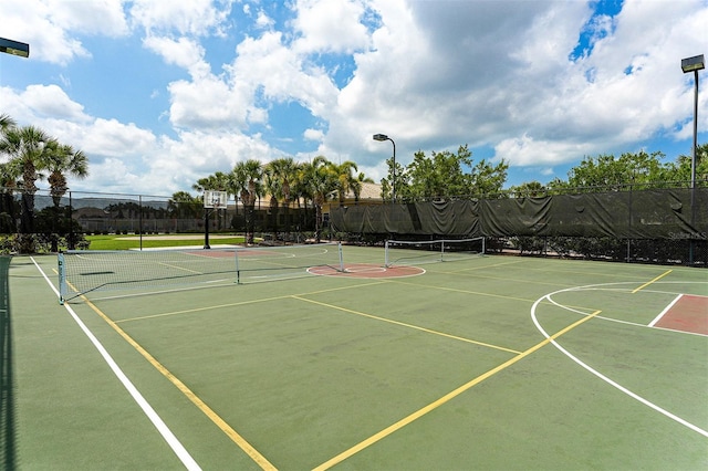 view of basketball court featuring tennis court