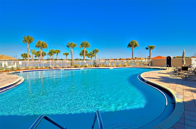 view of swimming pool featuring a patio area