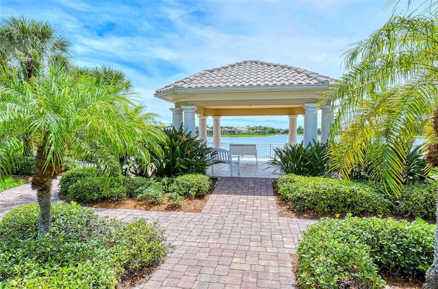 view of community with a gazebo and a water view