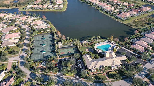 birds eye view of property with a water view